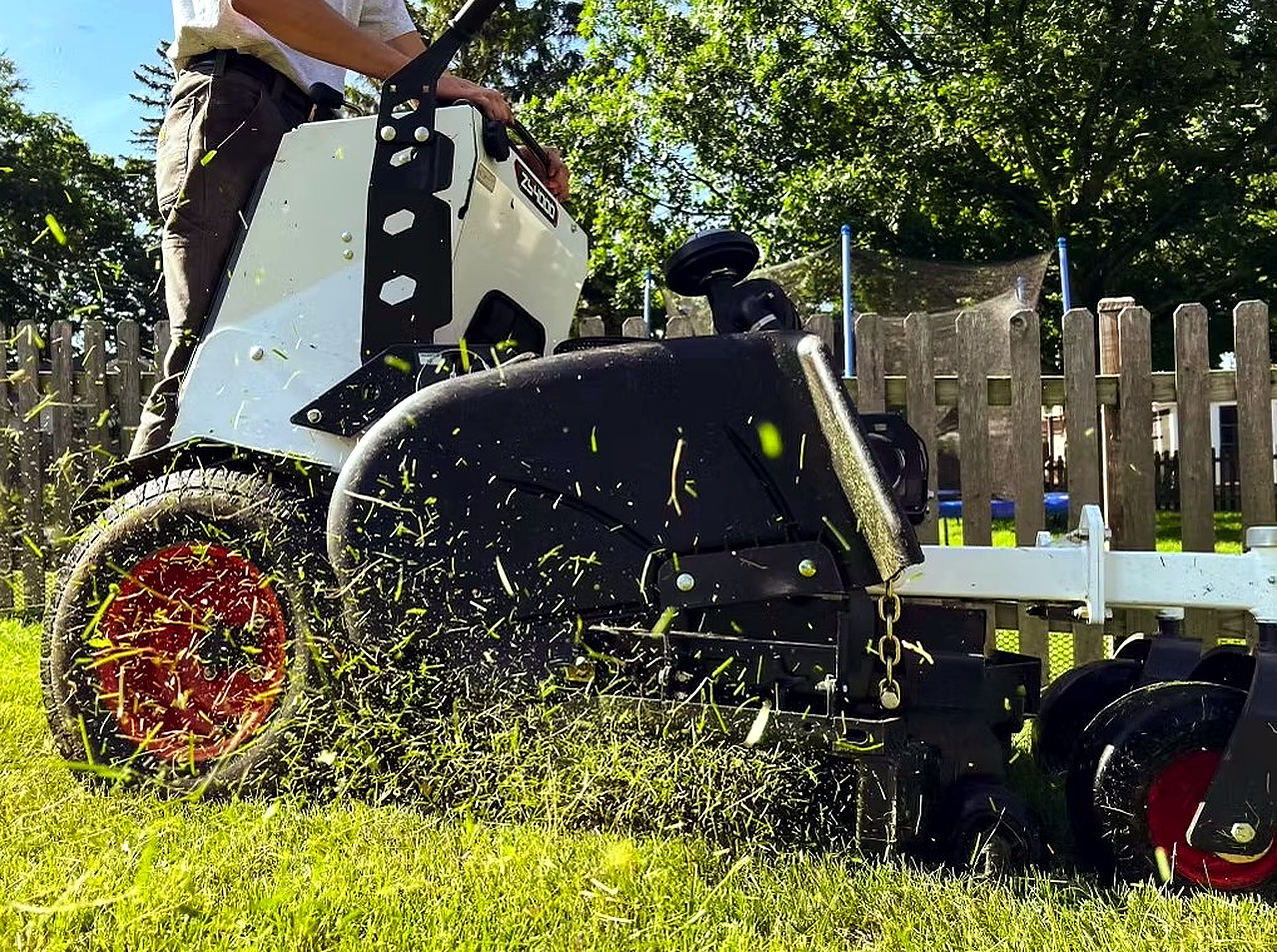 Stand-on mower cutting a fresh lawn