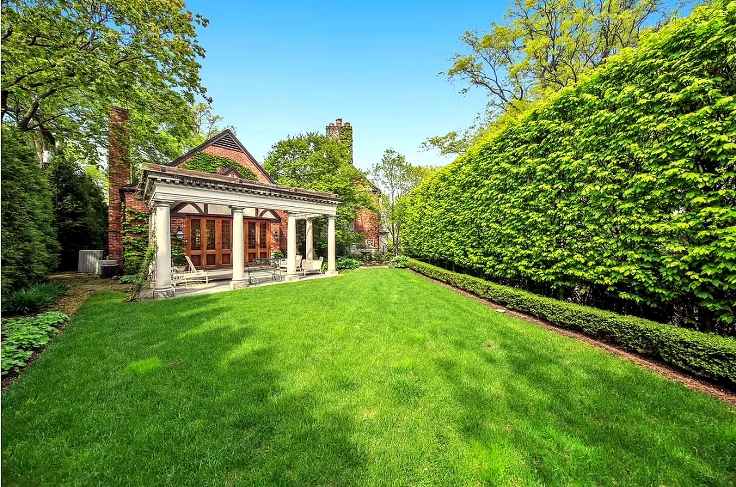 Brick home with a professionally striped front lawn